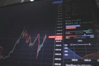 screen showing bitcoin trading chart by Nick Chong courtesy of Unsplash.